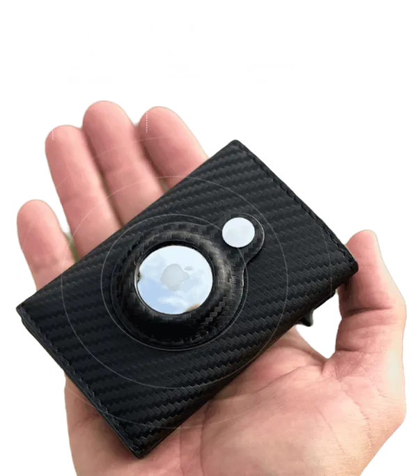 Smart wallet with a built-in AirTag slot held in one hand