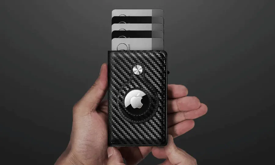 SafeTrack Wallet with cards popped up by the slide lever and an AirTag in the built-in slot